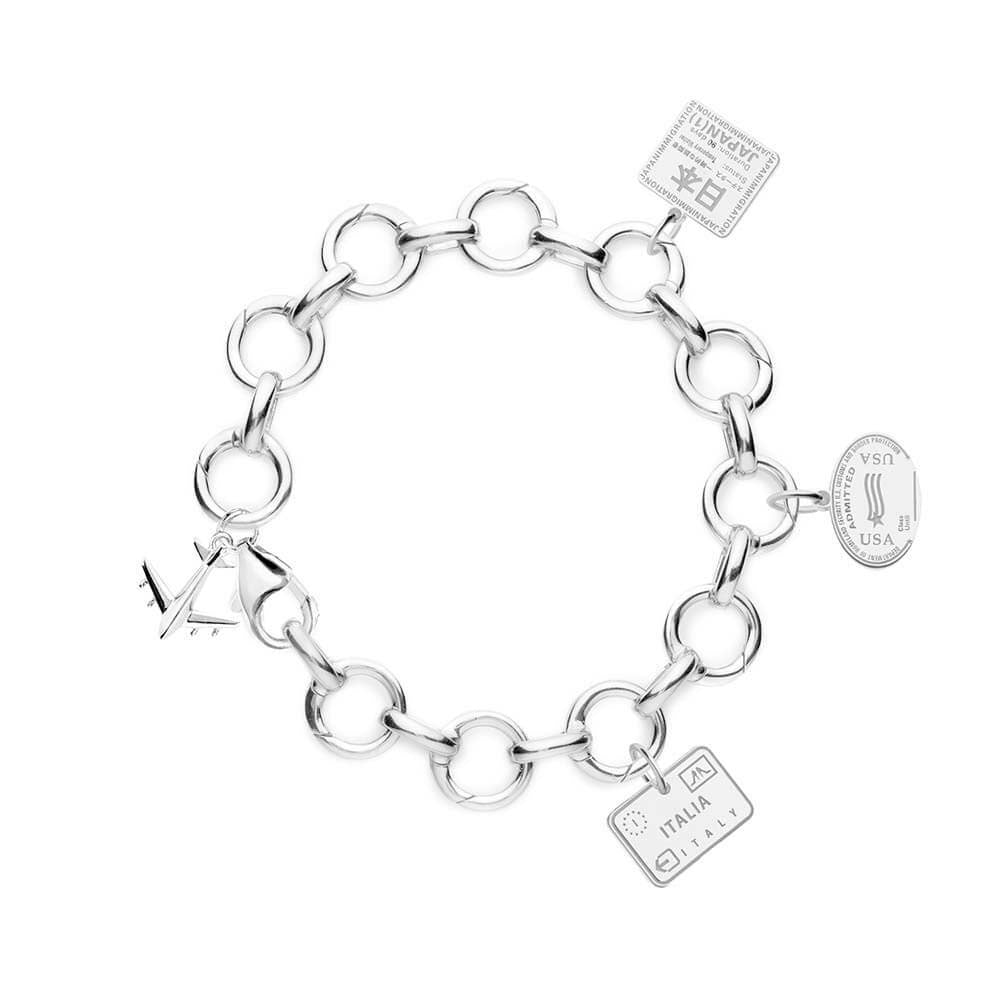 Sterling SILVER CHARM BRACELET WITH 3 PASSPORT STAMP CHARMS. Jet Set Candy makes travel charms for virtually every country in the world. Featured here are the follow travel charms: a passport stamp charm for Italy, a USA passport stamp charm, and a Japan Passport Stamp Charm. The bracelet comes on a sterling silver Jet Set Candy charm bracelet where every link opens. The bracelet also comes with a silver airplane charm.