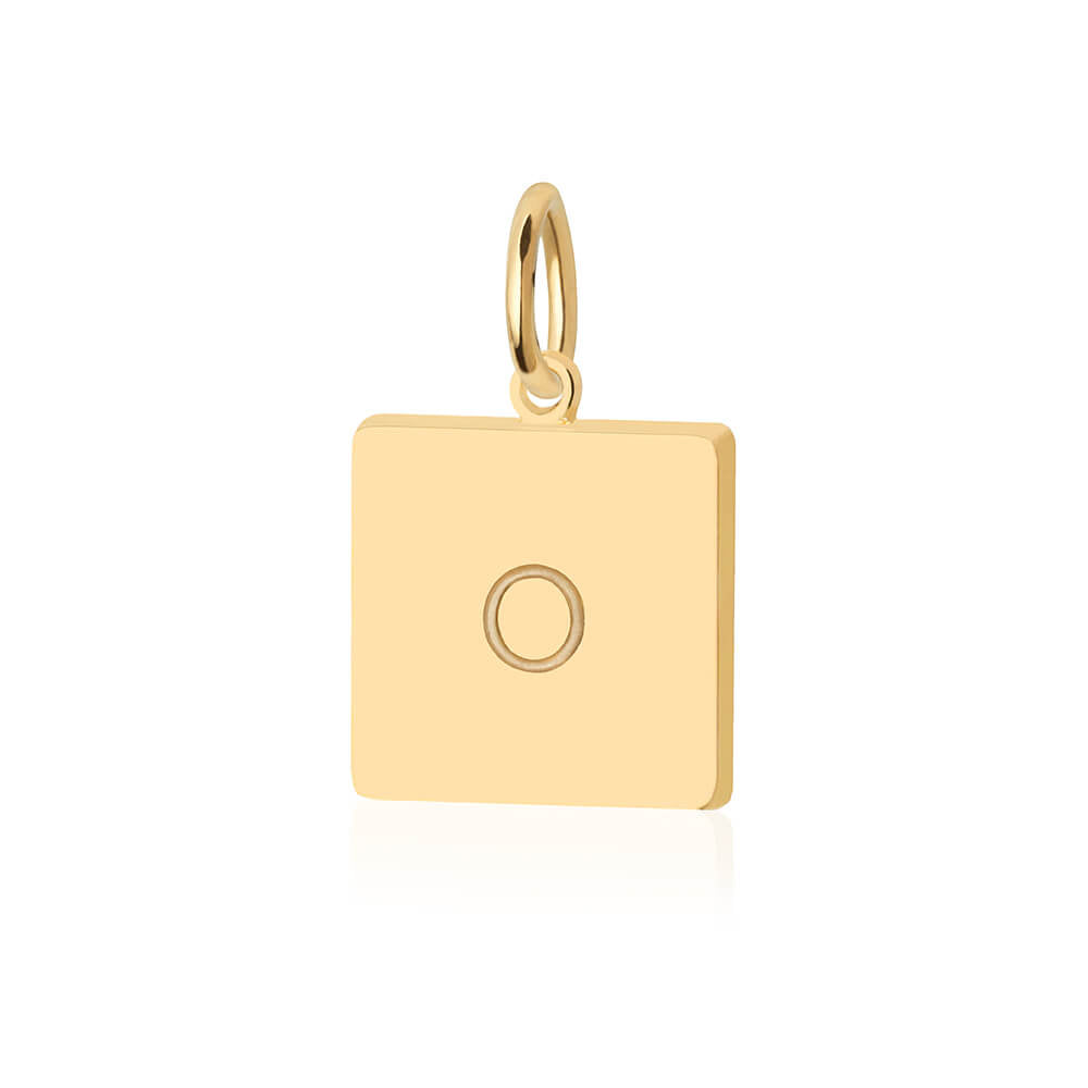 Gold charm featuring a square tag design with a minimalist engraved letter O motif and polished gold finish.
