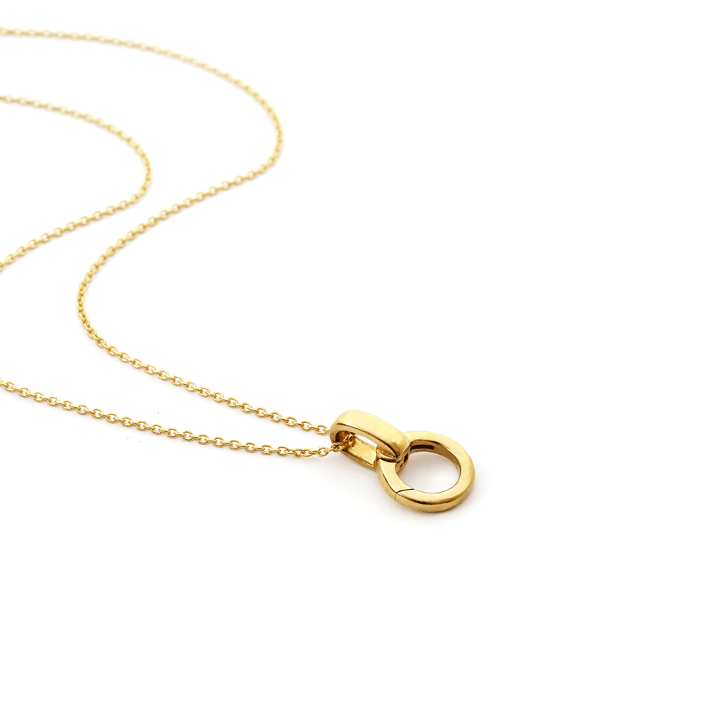 Animated gold charm holder set with cable chain by Jet Set Candy, showcasing a luggage tag charm.