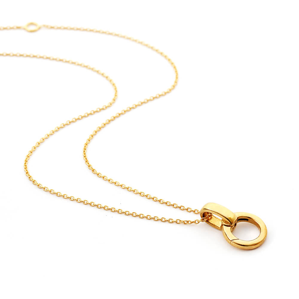 Delicate gold cable chain with a charm holder by Jet Set Candy, displayed on a white background.