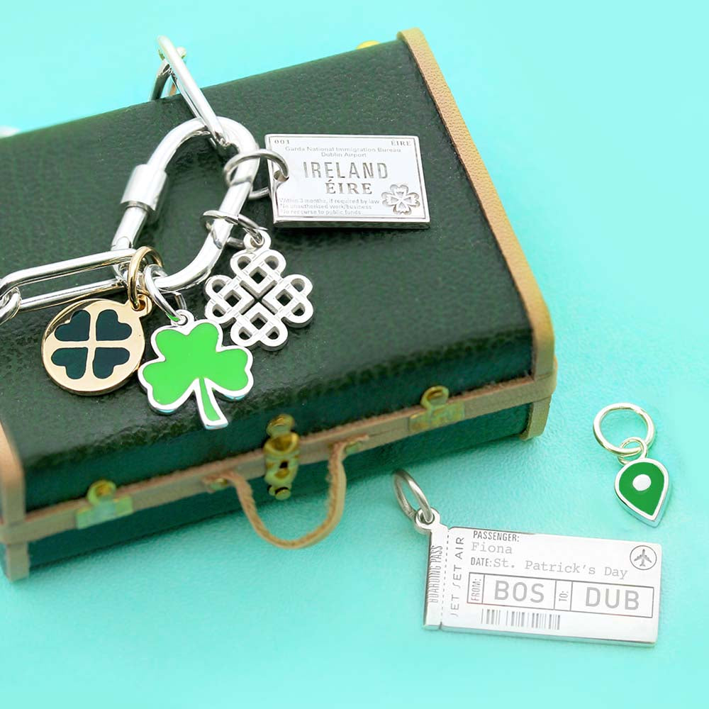 Sterling Silver and Enamel charms featuring an Ireland passport stamp, Celtic knot, green shamrock, and BOS to DUB boarding pass.