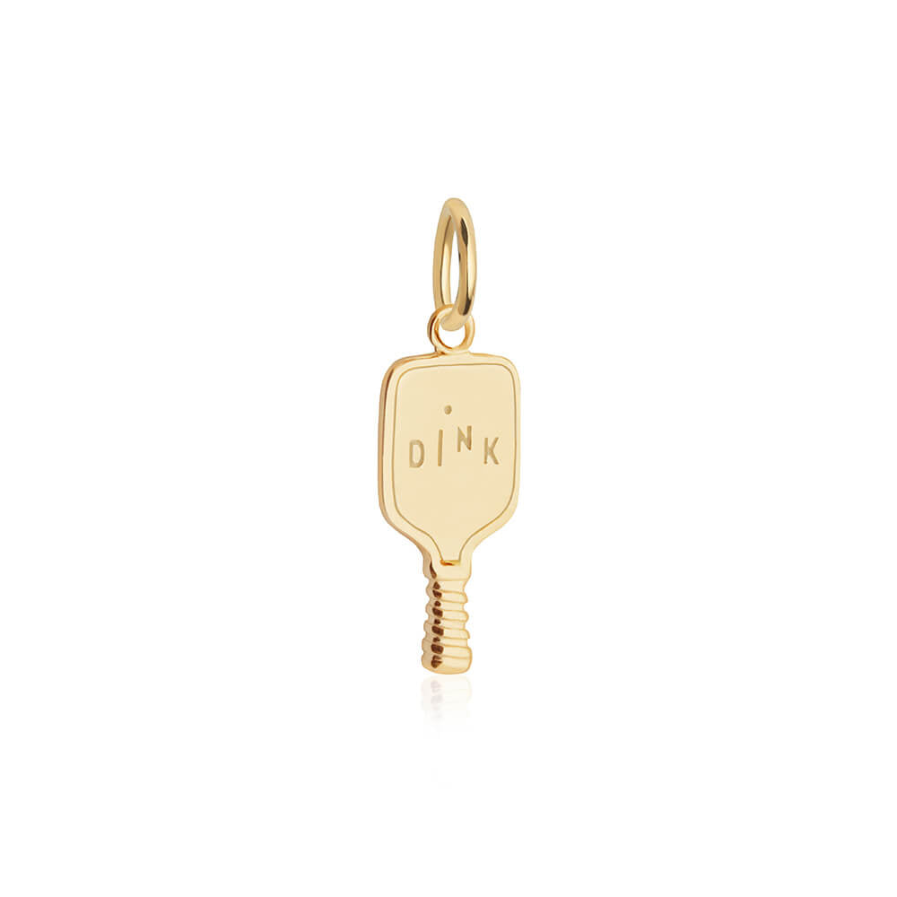 Gold pickleball paddle charm with a polished finish, featuring DINK engraving and textured handle detail on a hanging bail.