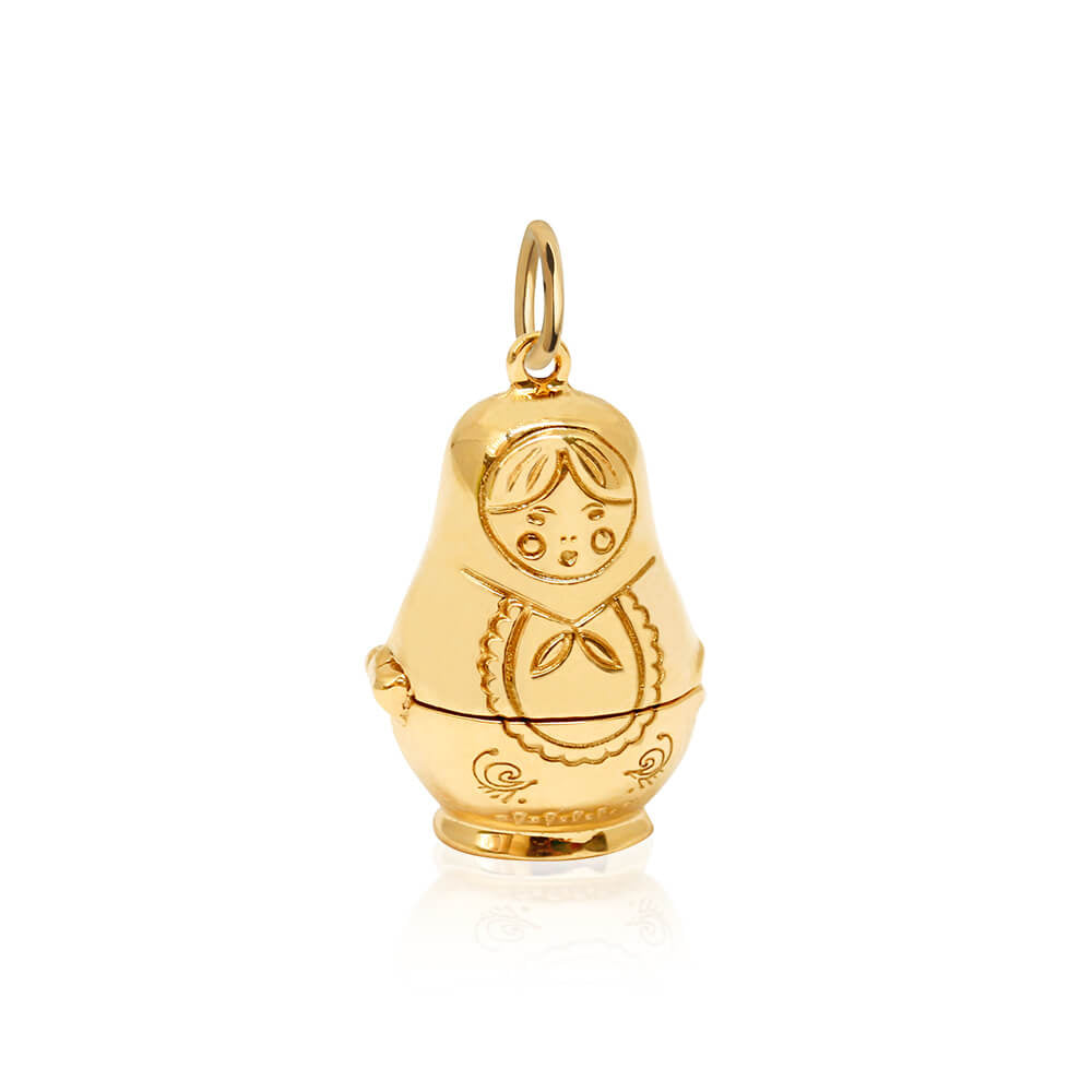 Gold Russian nesting doll charm by Jet Set Candy, featuring detailed engraving on a white background.