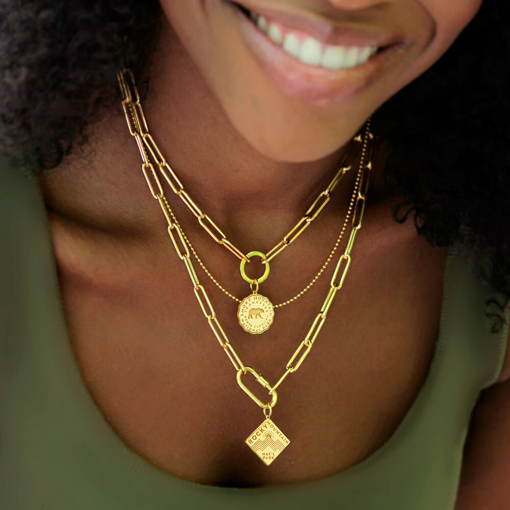 daily 360 paperclip gold vermeil necklace with smoky mountain national park gold vermail engraved charm, gold vermeil ball chain, and paperclip daily necklace with carabiner and rocky mountain engraved charm