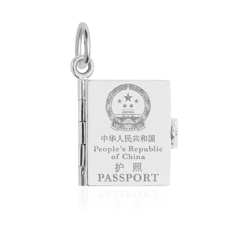 Silver China passport book charm by Jet Set Candy, featuring engraved details on a white background.