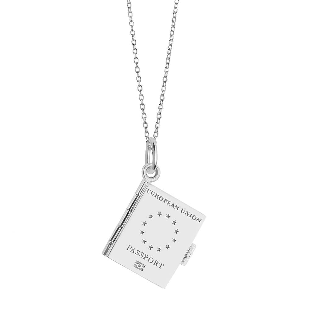 Silver Europe passport book necklace by Jet Set Candy, featuring an engraved pendant on a white background.
