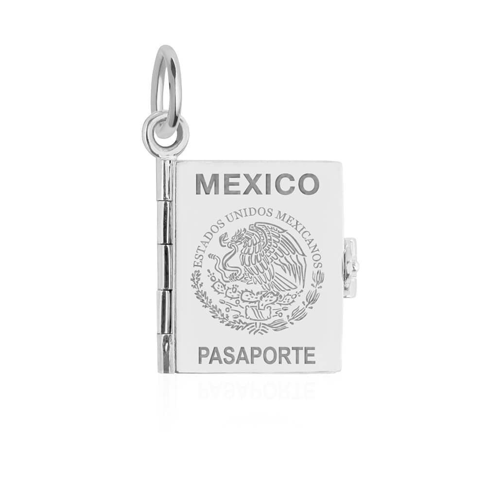 Silver Mexico passport book charm by Jet Set Candy, with detailed engravings on a white background.