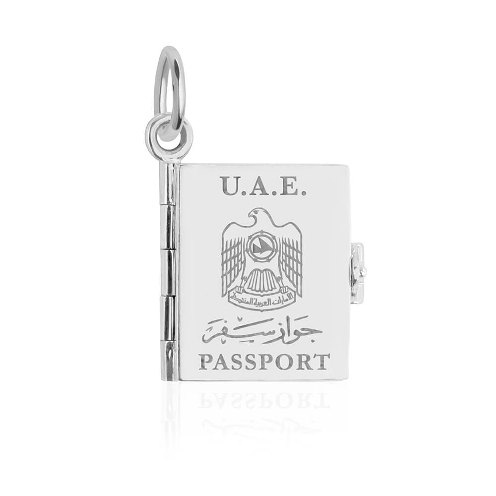 Silver UAE passport book charm by Jet Set Candy, featuring engraved cover details on a white background.