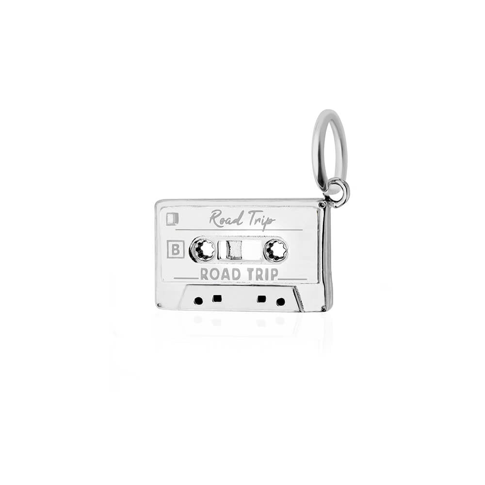 Silver cassette tape charm by Jet Set Candy, with 'Road Trip' engraving on a white background.