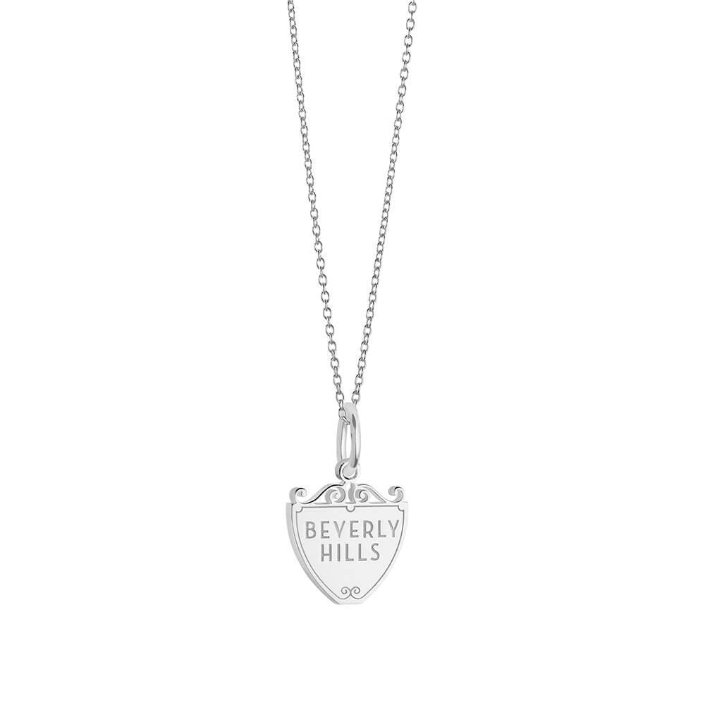 Sterling Silver charm featuring a shield design with Beverly Hills engraving and decorative scroll motifs on a matching chain.