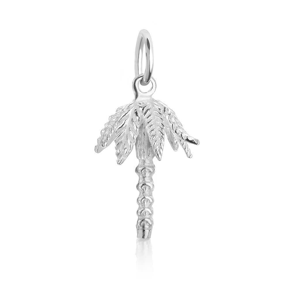 Silver palm tree travel charm by Jet Set Candy, with detailed engravings on a white background.