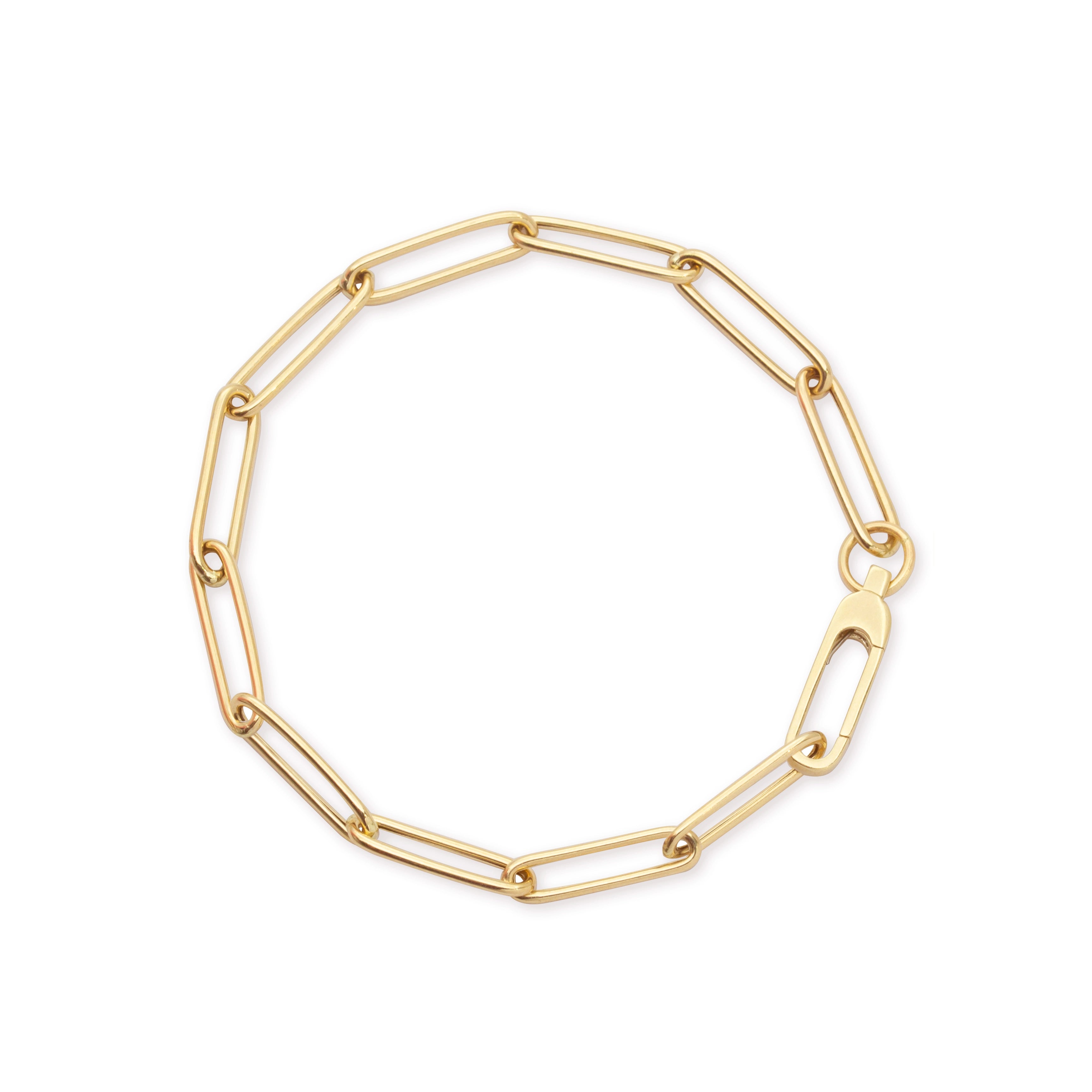 Gold paperclip chain bracelet featuring elongated rectangular links and a polished finish with a secure lobster claw clasp.