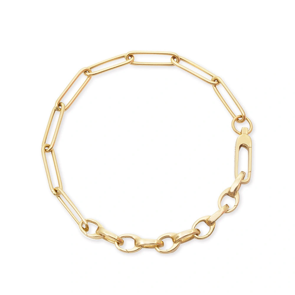 Gold charm bracelet featuring a combination of elongated paperclip links and smaller oval links with a lobster claw clasp.