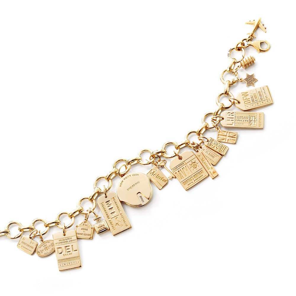 Gold Infinity Link Travel Charm Bracelet featuring a variety of solid gold travel charms including charms for New York City, Martha's Vineyard, Dallas, London, Paris, U.A.E., Delhi, and Melbourne