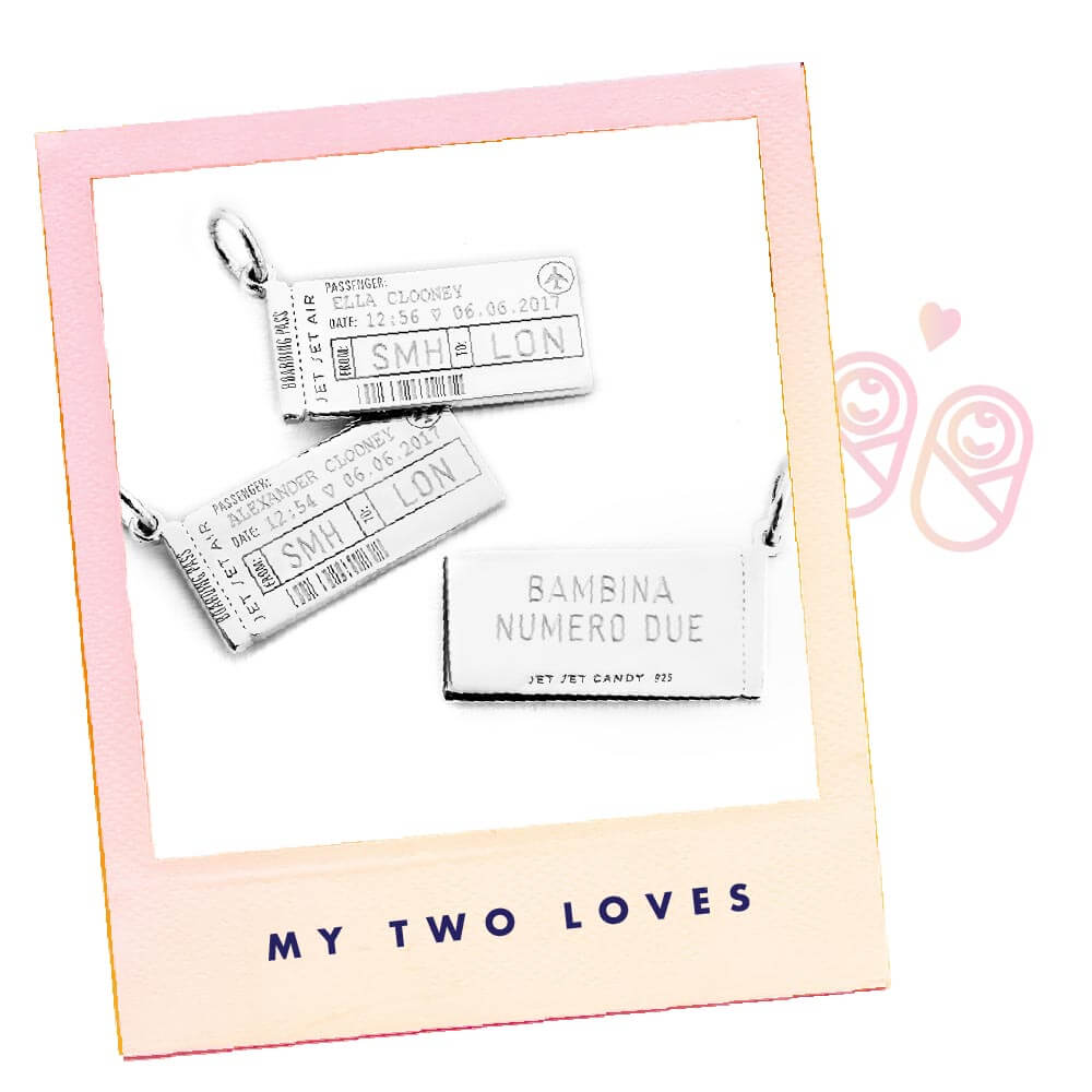 Photo of a pink polaroid frame with three Sterling Silver Boarding Pass Charms from JET SET CANDY being shown on a white background. On the polaroid frame are the words “MY TWO LOVES”